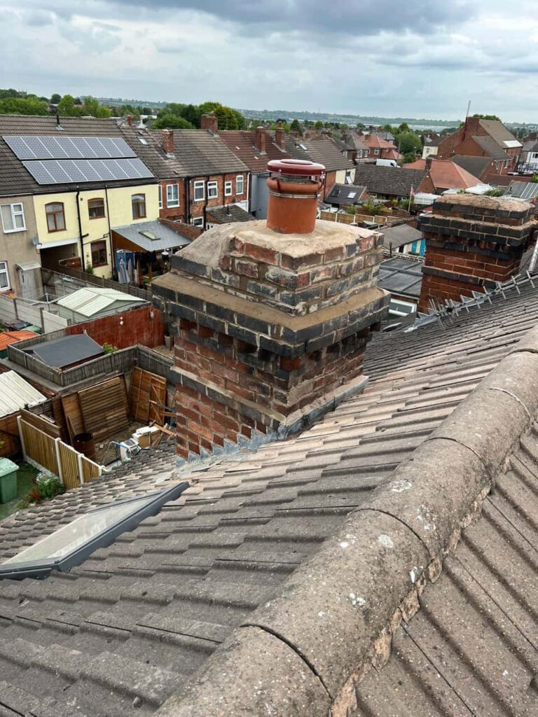 This is a photo taken from a roof which is being repaired by Ilkeston Roofing Repairs, it shows a street of houses, and their roofs